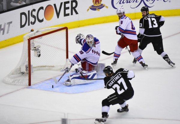 Los Angeles Kings defender Alec Martinez (27) scores the winning goal in double overtime against the New York Rangers during Game 5 of the Stanley Cup Finals at the Staples Center in Los Angeles, June 13, 2014. The Kings won the championship series 4 games to 1. (Stuart Palley/The New York Times)