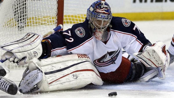 Columbus Blue Jackets goalie Sergei Bobrovsky, of Russia, makes a save during the second period of an NHL hockey game against the St. Louis Blues on Saturday, Feb. 23, 2013, in St. Louis. (AP Photo/Jeff Roberson)